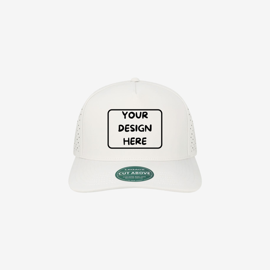 Front view of White LEGACY CUT The Cut Above five-panel cap showing the structured crown and slightly curved bill