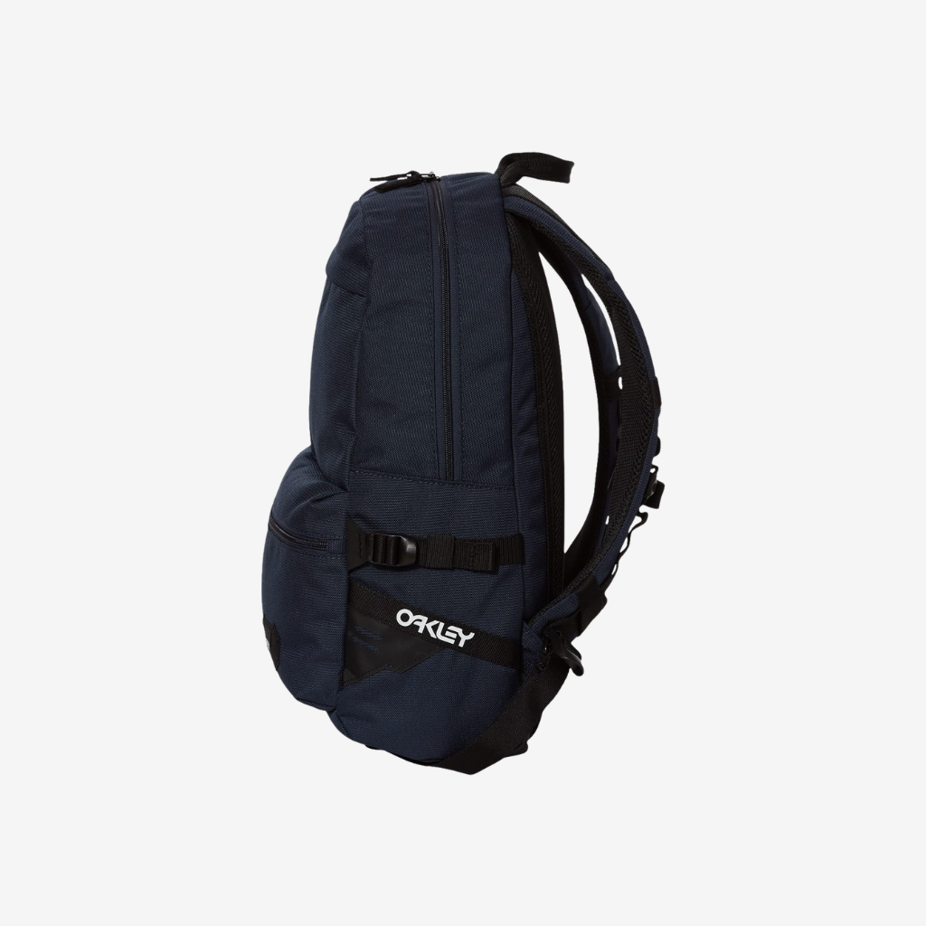 Side view of Oakley 20L Street Backpack in Fathom color highlighting slim profile and functional storage