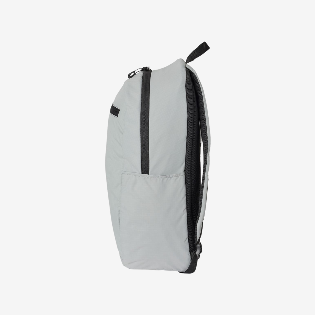 Side view of Oakley 22L Sport Backpack in Stone Grey color highlighting compact design and storage features