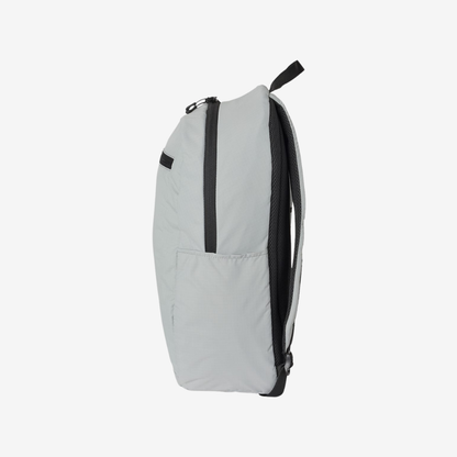 Side view of Oakley 22L Sport Backpack in Stone Grey color highlighting compact design and storage features