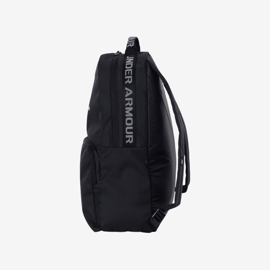 Side view of Under Armour Loudon backpack in black and white color showing compact profile and functional storage capacity