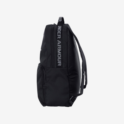 Side view of Under Armour Loudon backpack in black and white color showing compact profile and functional storage capacity