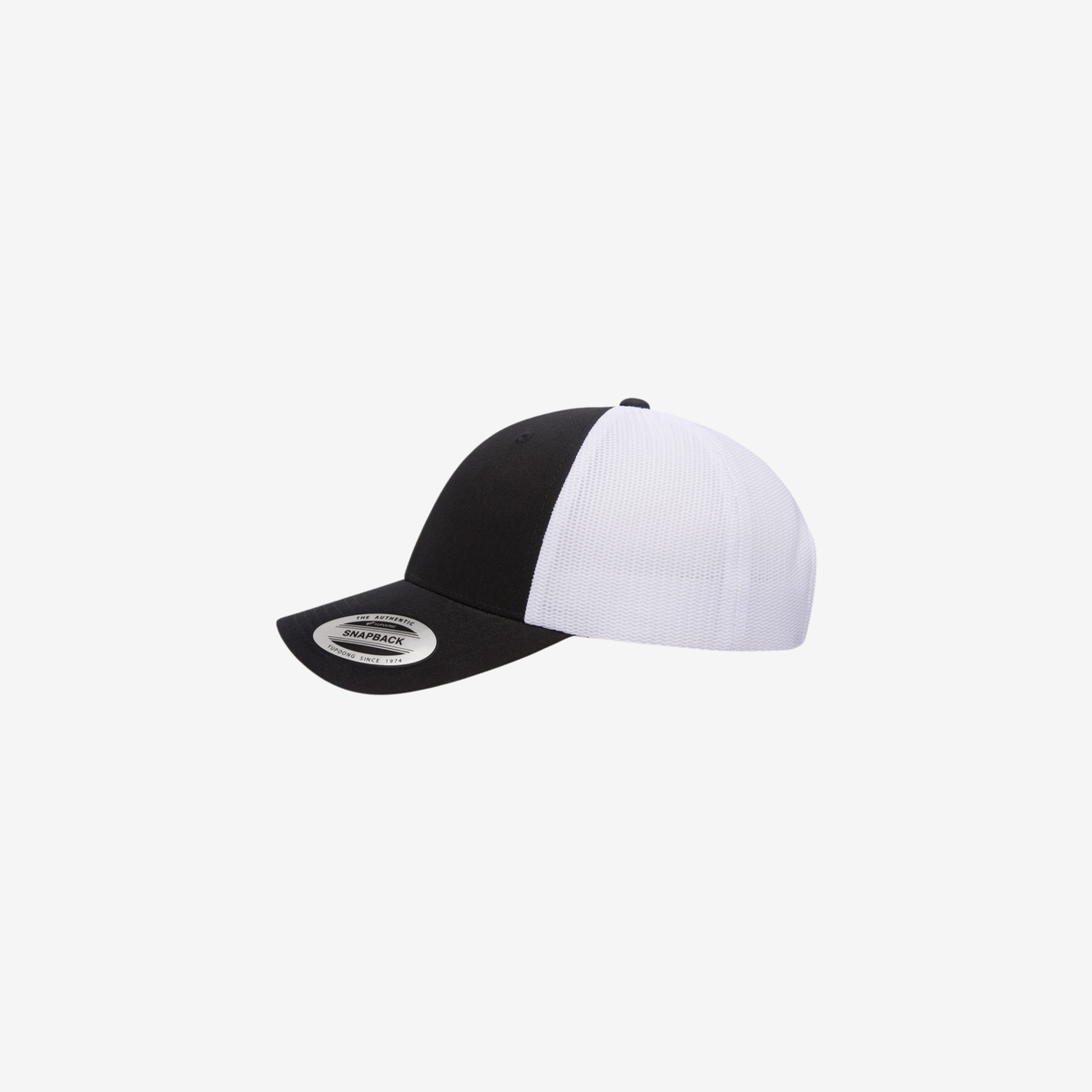 Side view of Black and White YP Classics 6601 Elite trucker hat showing the low-profile crown, black curved bill and white mesh panels