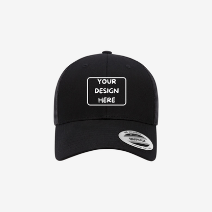 Black YP Classics 6601 Elite low-profile trucker hat with a curved bill and mesh back